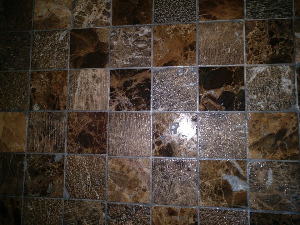 brown and grey shiny stone mosaic with grey grout