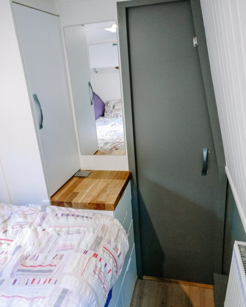 A Modern Narrowboat bedroom storage Cluett Carpentry A Gentle grey and white colour scheme