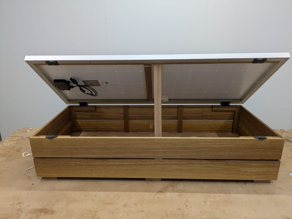 SolarBox Cluett Carpentry Roof Box with a solar panels